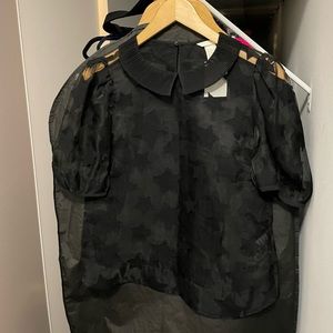 Collared see through star black top